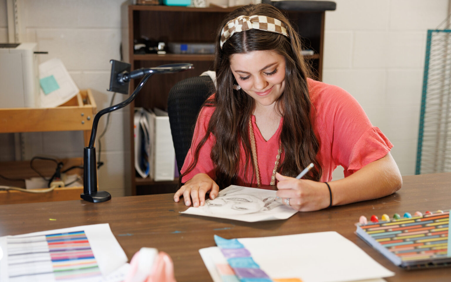 A student drawing a picture.