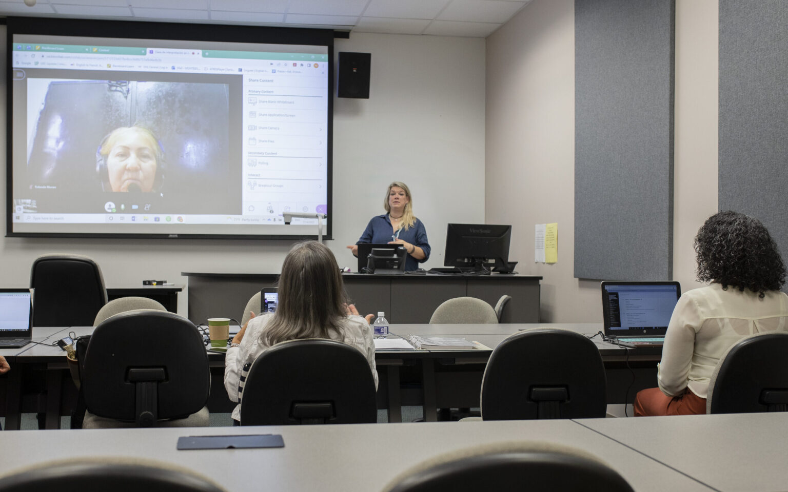 A teacher at podium