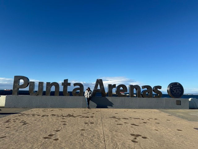 a person in front of a sign